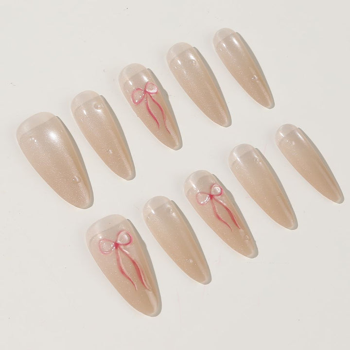 Elegantes Stiletto Press-On Nagelset mit Schleifenakzenten Karnz