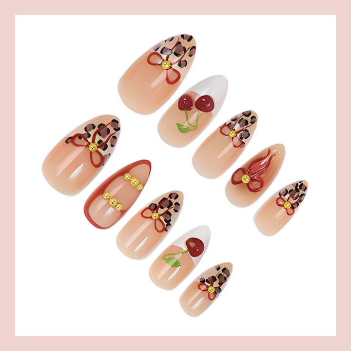 Kunstnagelset mit kreativen Schleifen- und Fruchtdesigns Karnz