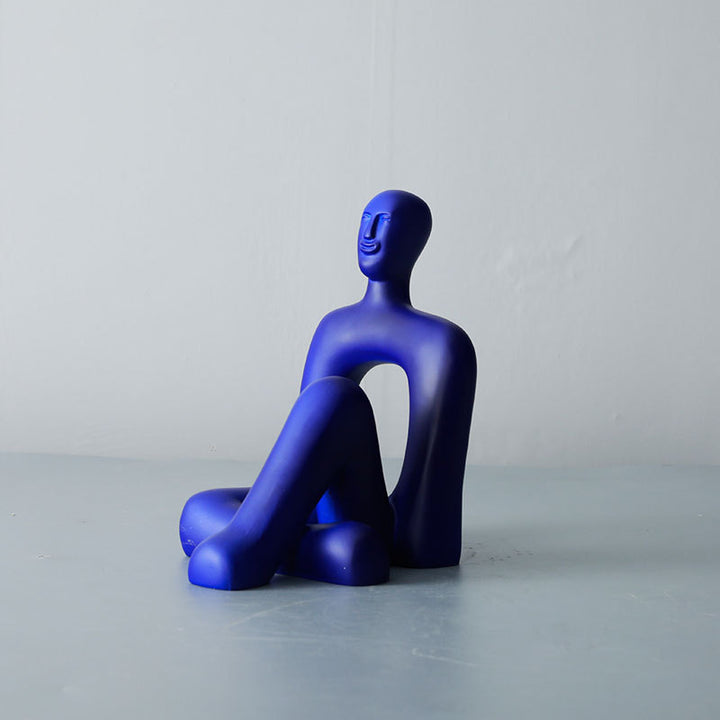 Abstrakte dekorative Sitzfigur