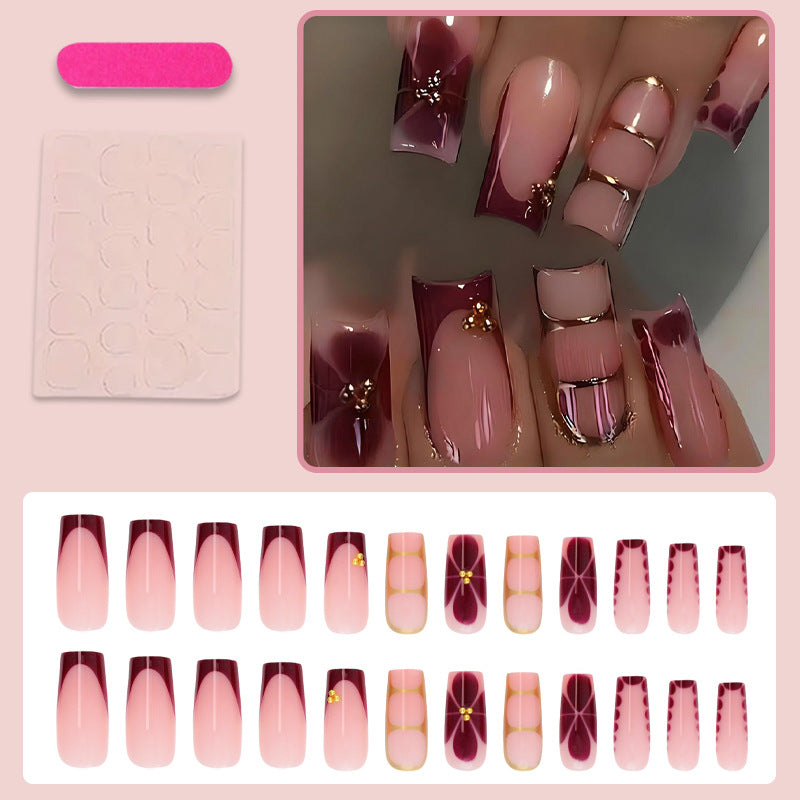 Kunstnagelset mit eleganten Farbverlauf und filigranen Verzierungen Karnz