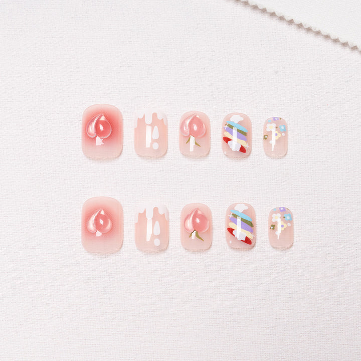 Dekorative Nagelkunst mit Früchten und Pastell-Designs