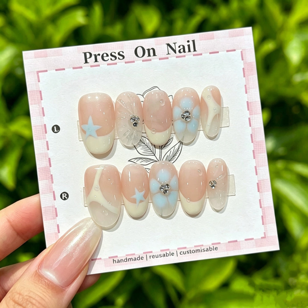 Künstlerisches Press-On-Nagel-Set mit Blumen- und Stern-Designs