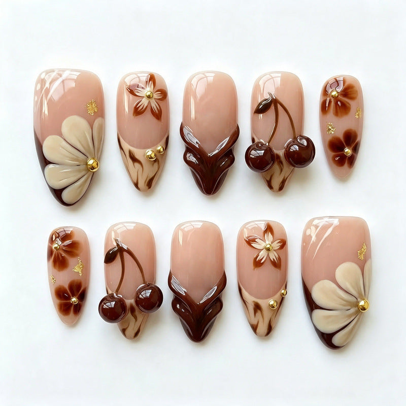 Künstlerisches Press-on-Nagel-Set mit floralen und Kirschdesigns