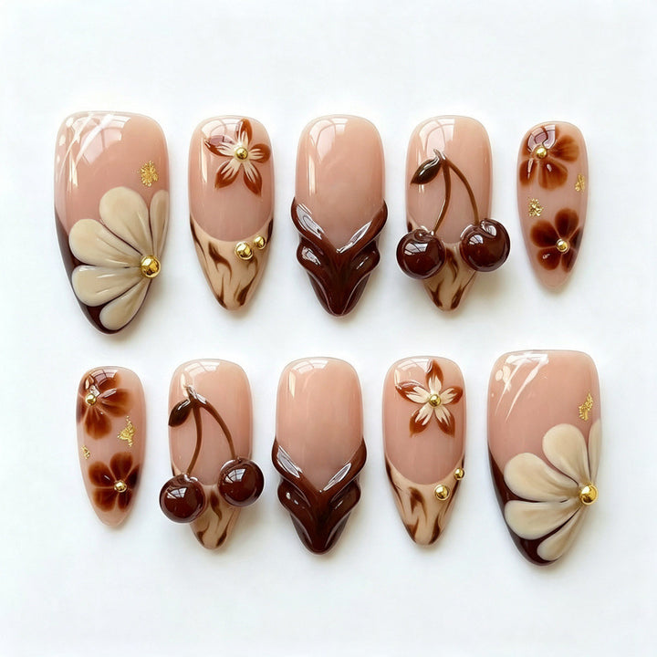 Künstlerisches Press-on-Nagel-Set mit floralen und Kirschdesigns