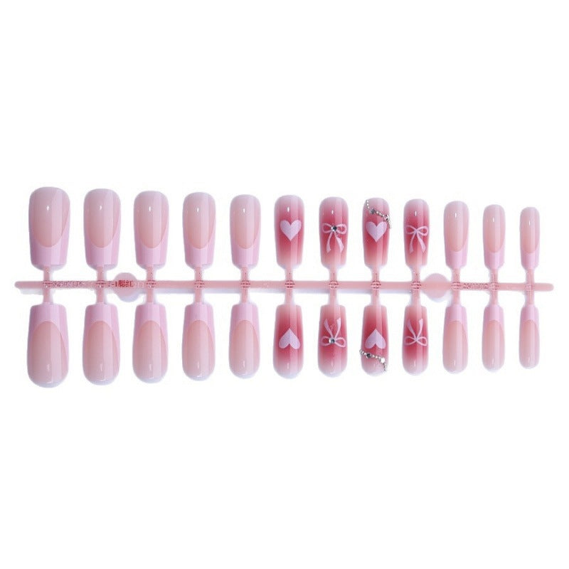 Kunstnagelset mit eleganten Schleifen- und Glitzermotiven Karnz