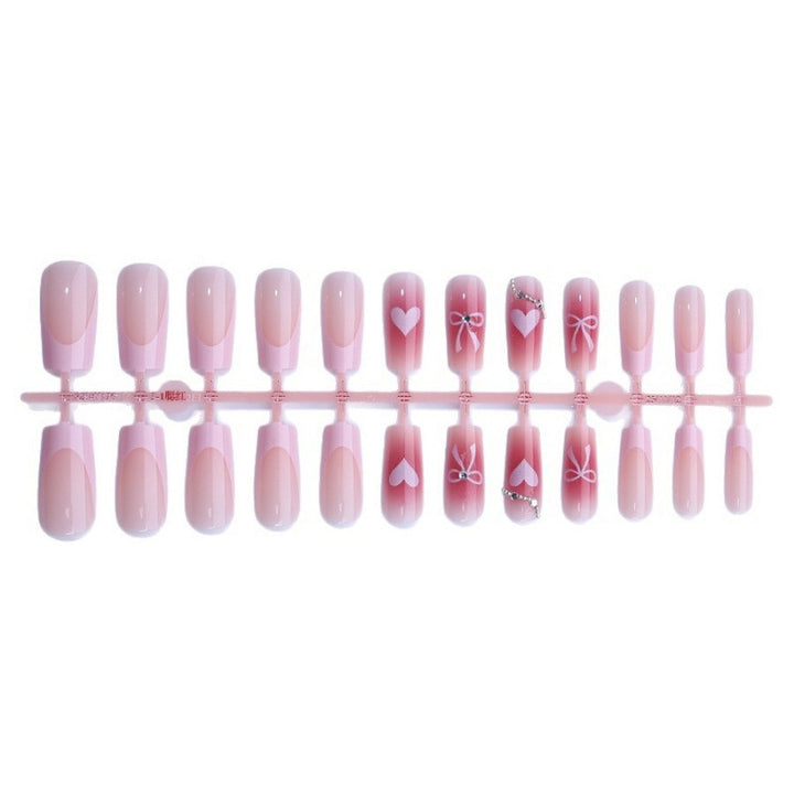 Kunstnagelset mit eleganten Schleifen- und Glitzermotiven Karnz