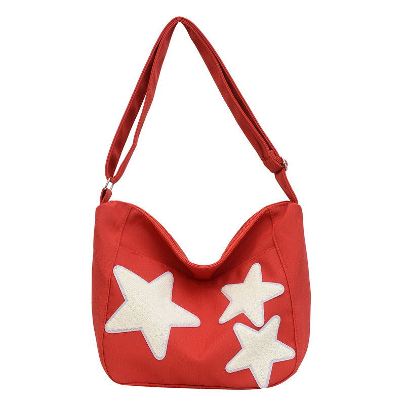 Lässige mit Sternen verzierte Schultertasche