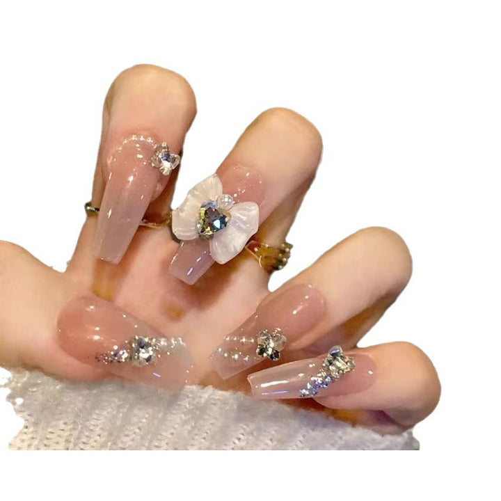 Elegante Kunstfingernägel mit Blumendekor und Glitzer Karnz