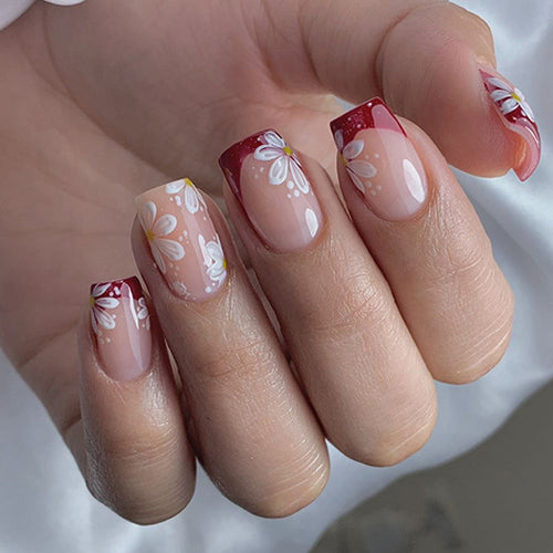 Kunstvolle Nagelverlängerungen mit Blumenmotiv Karnz