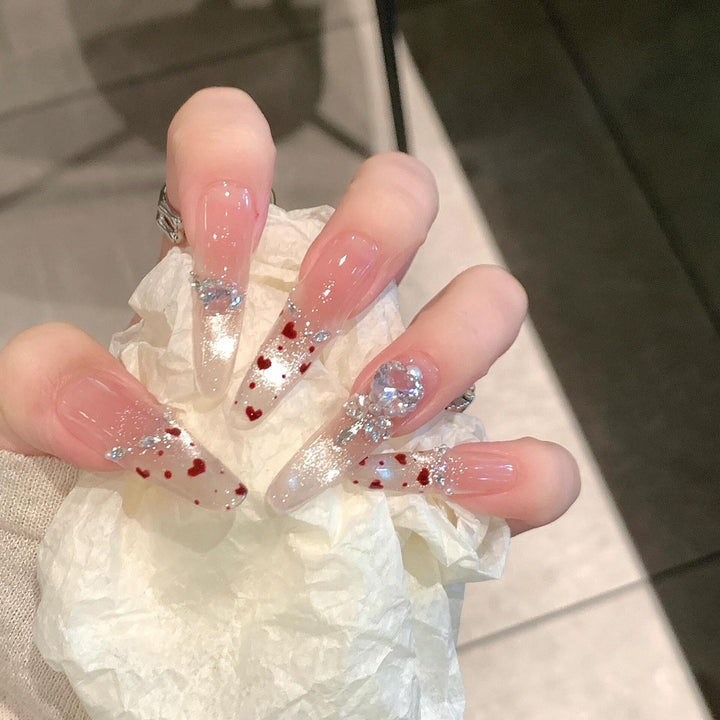 Kunstnagelset mit Funkelnden Strass- und Herzdesign Karnz