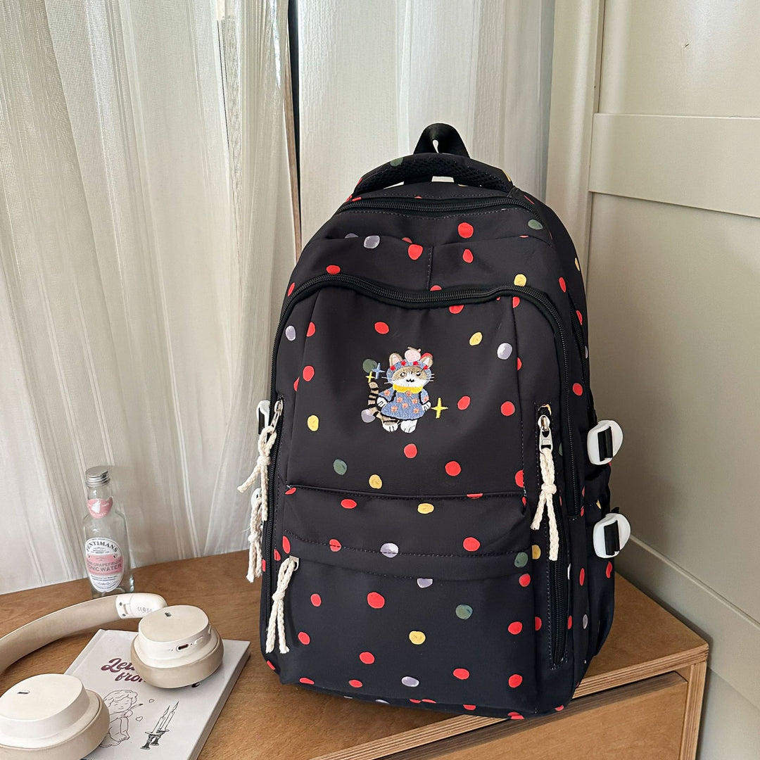 Verspielt gemusterter Schulrucksack