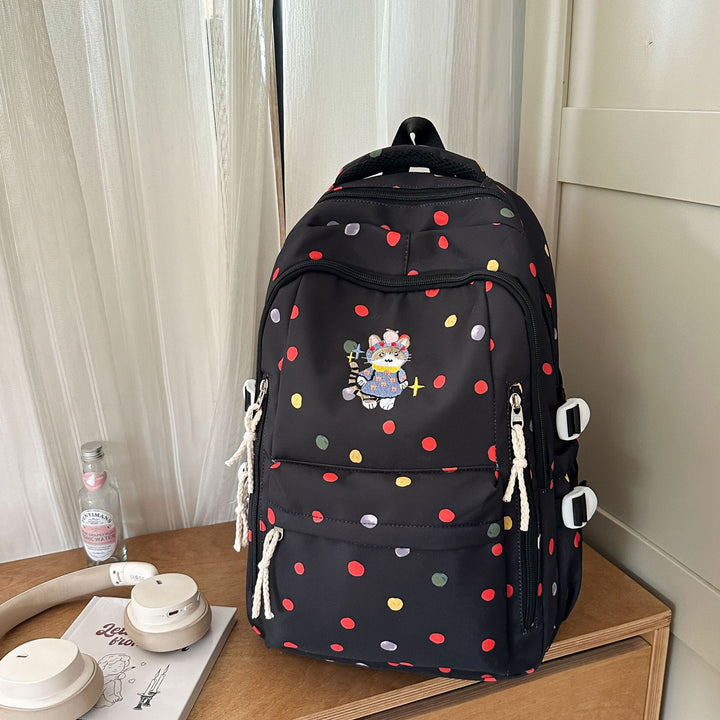 Verspielt gemusterter Schulrucksack
