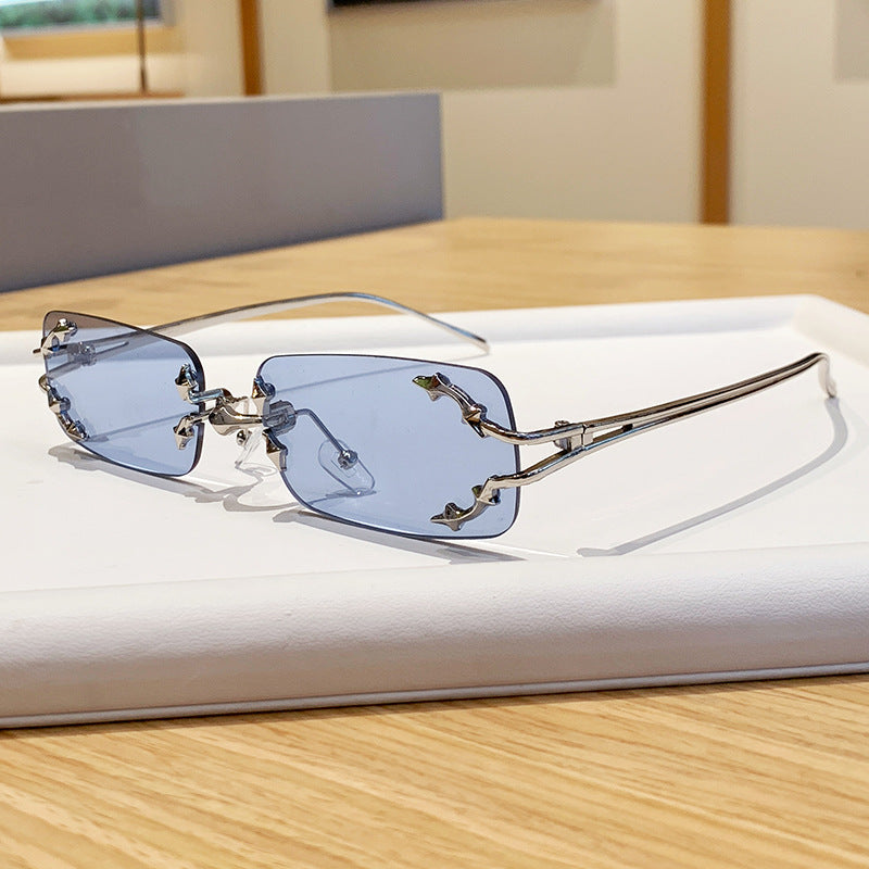 Damen modische Sonnenbrille mit filigranem Metallrahmen und transparenten Gläsern Karnz