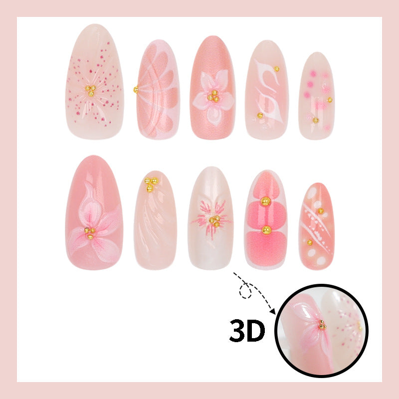 Kunstnägel mit floralen Designs und Glitzerakzenten Karnz
