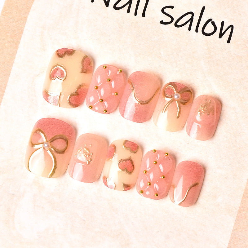 Elegantes Herz- und Band-Thema Press-On Nagelset Karnz