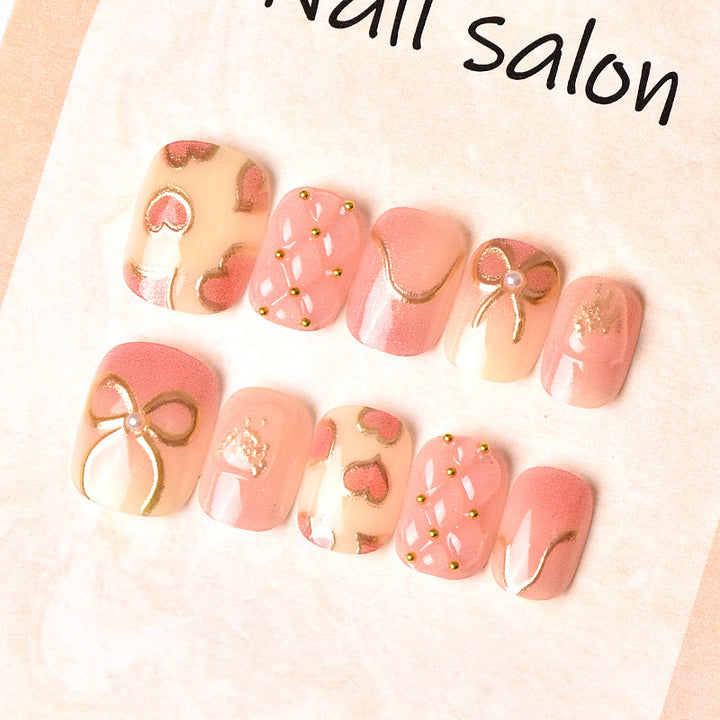 Elegantes Herz- und Band-Thema Press-On Nagelset Karnz