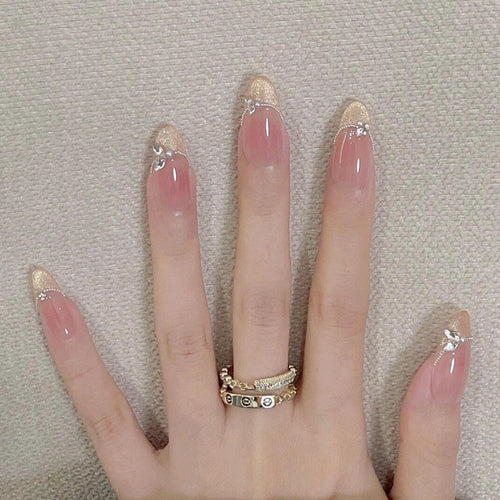 Elegante Stiletto Press-On Nägel mit Edelsteindetails Karnz