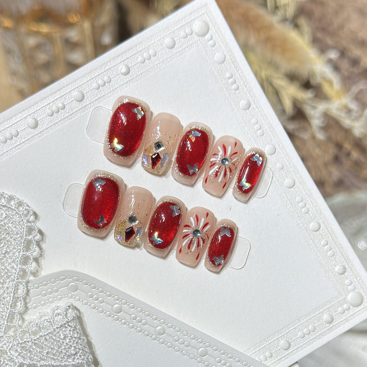 Künstlerisches Press-On Nail Set mit Glitzer und Sternelementen Karnz