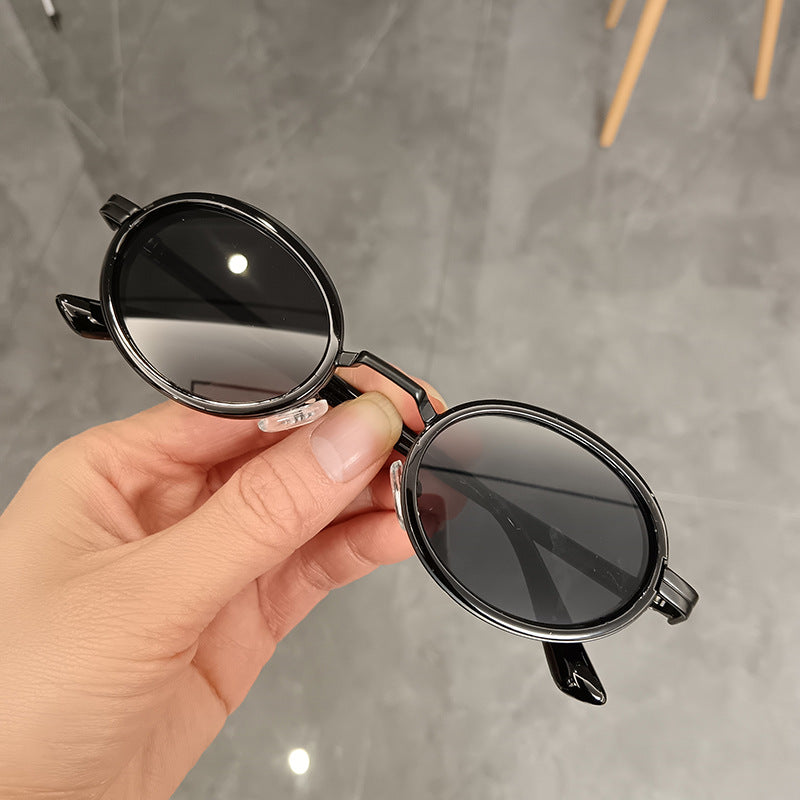 Damen runde Sonnenbrille mit leichten Gläsern und goldenen Akzenten Karnz