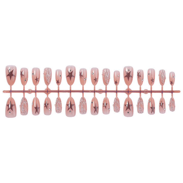 Kunstnagelset mit eleganten Stern- und Glitzerdetails Karnz