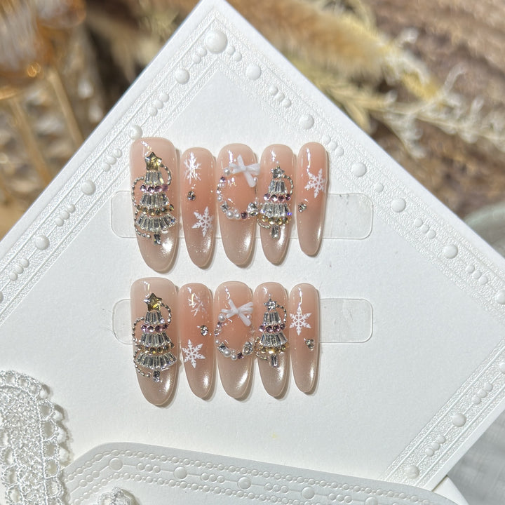 Dekoratives Stiletto Press-On Nagelkunst-Set mit Schneeflocken- und Edelsteinakzenten Karnz