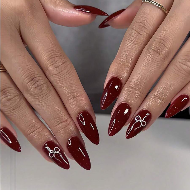 Kunstnagelset mit elegantem Bogen-Design Karnz