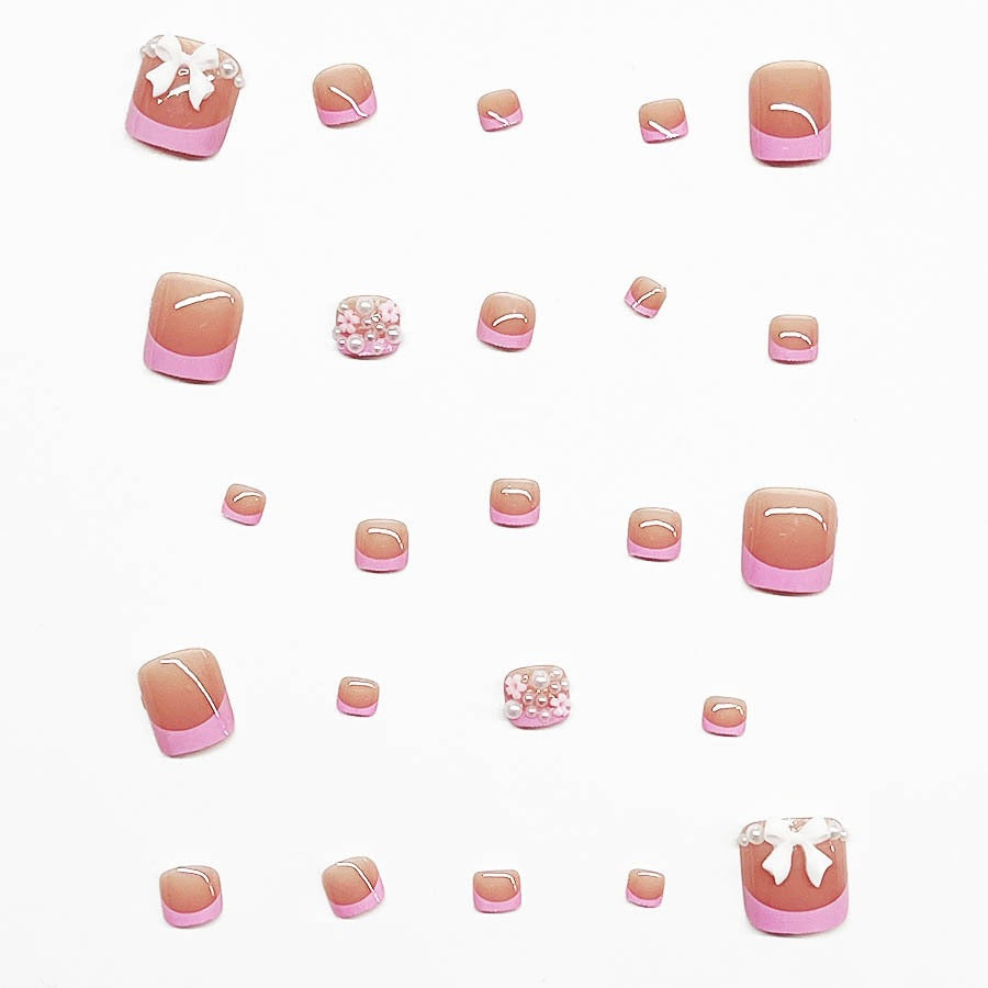 Dekorativer Press-On Nagelkunst Set mit floralen und Schleifenakzenten Karnz