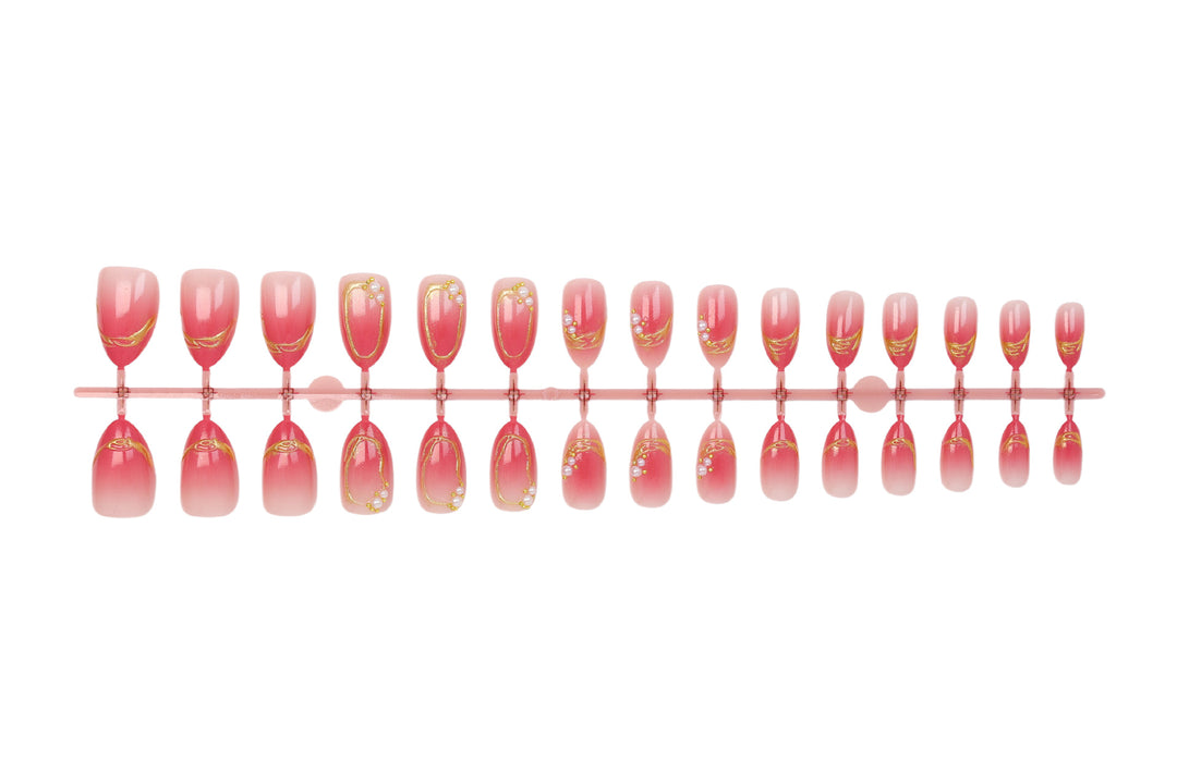 Kunstnagelset mit eleganten Ombré-Designs und Glitzerakzenten Karnz