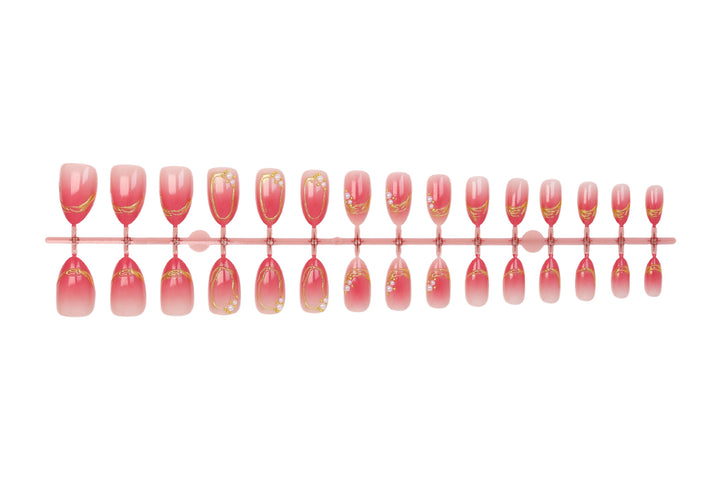 Kunstnagelset mit eleganten Ombré-Designs und Glitzerakzenten Karnz