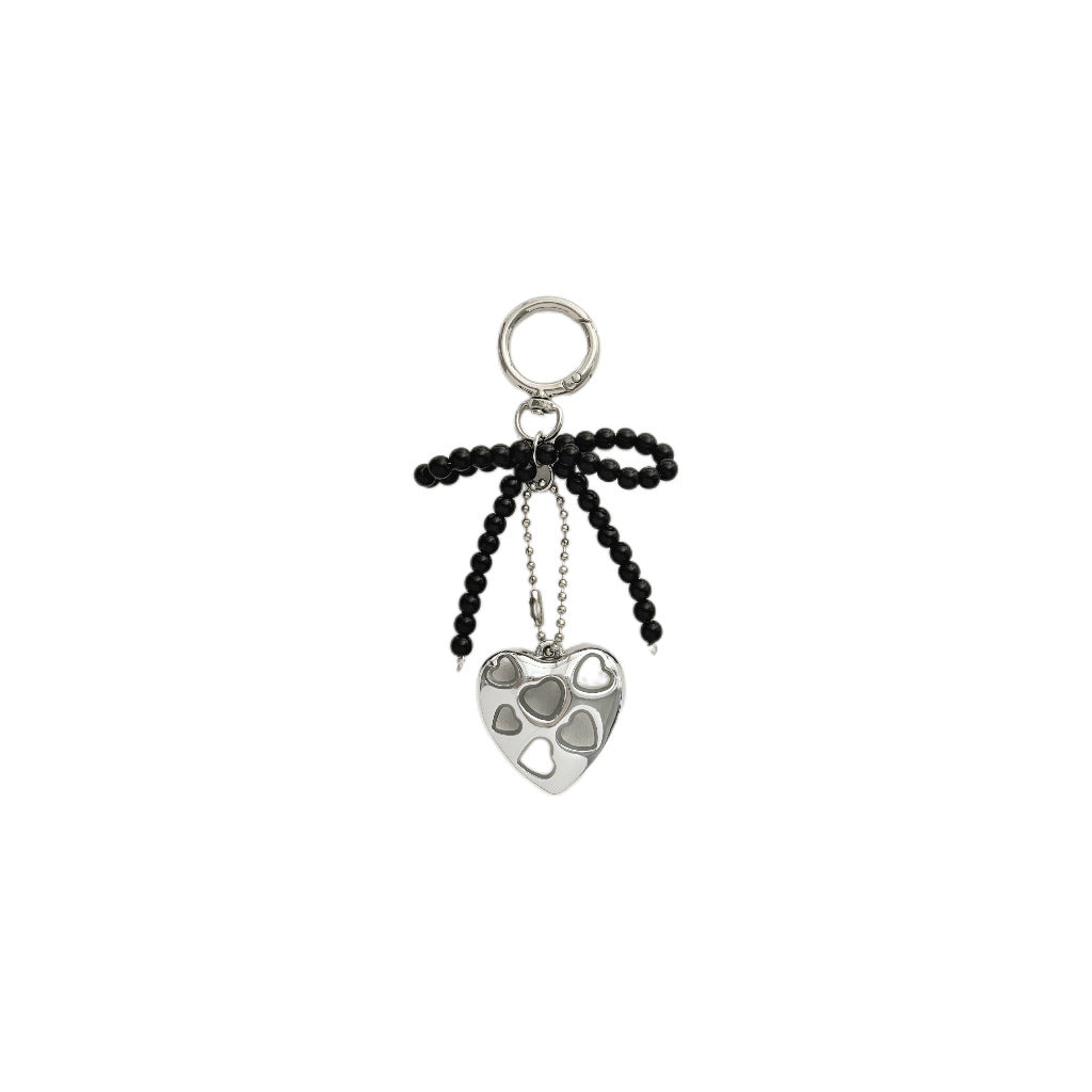Herzförmiger Charm-Schlüsselanhänger mit Perlen-Schleife Karnz