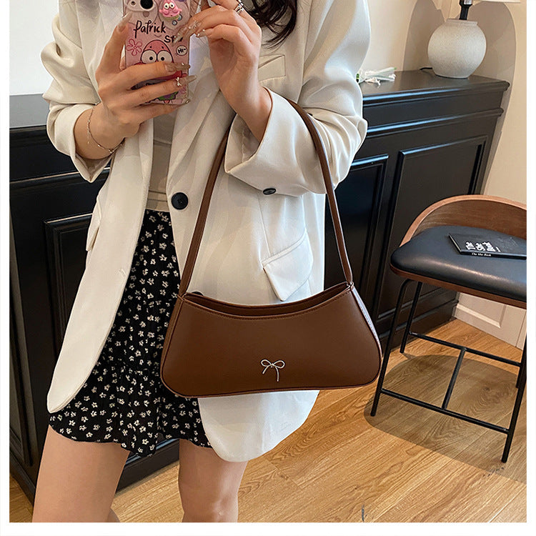 Elegante geschwungene Handtasche Karnz