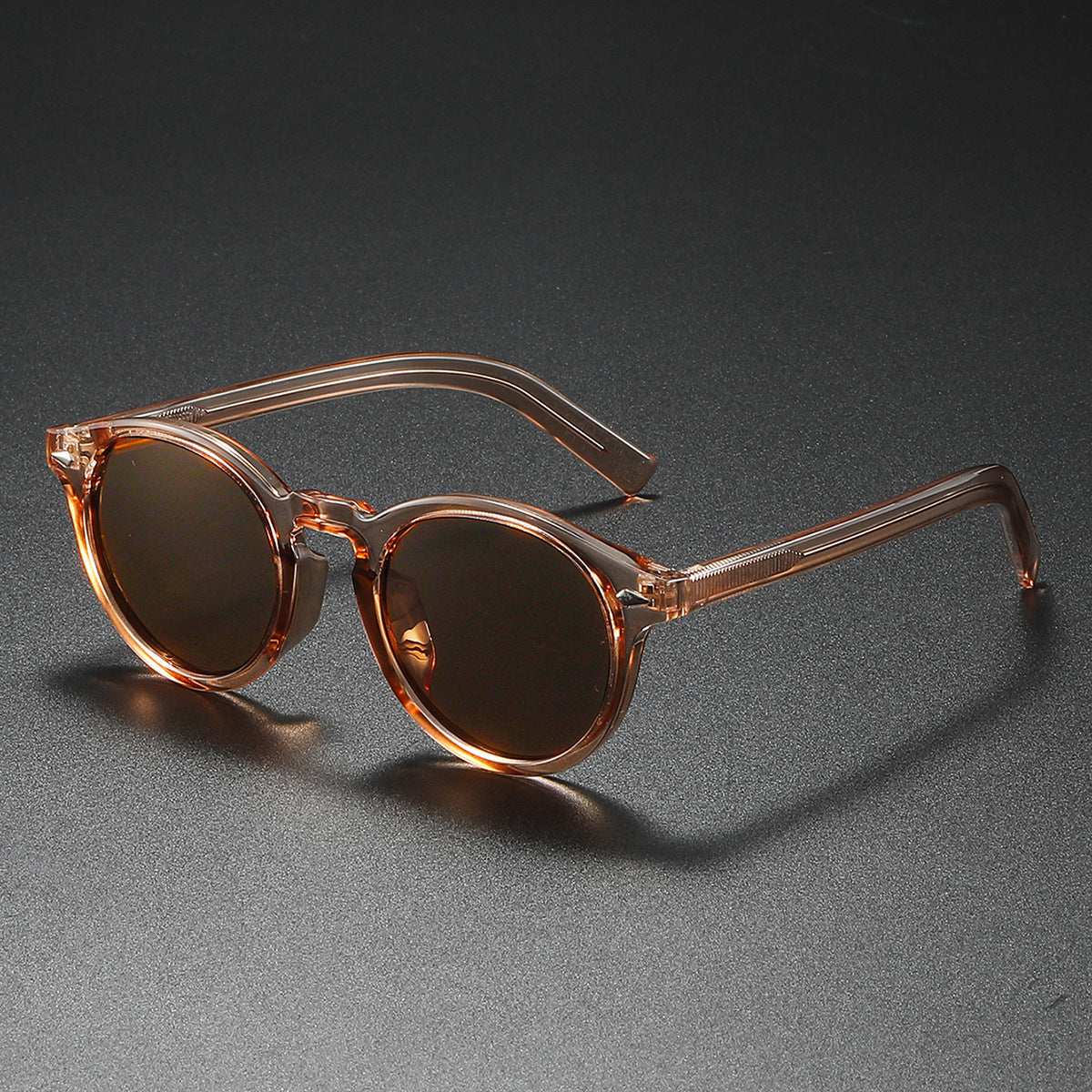 Damen Rund-Sonnenbrille mit transparentem Rahmen und reflektierenden Gläsern Karnz