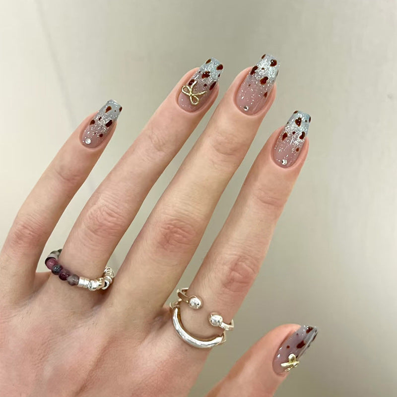 Dekorativer Press-On-Nagelset mit Glitzer und floralen Akzenten Karnz