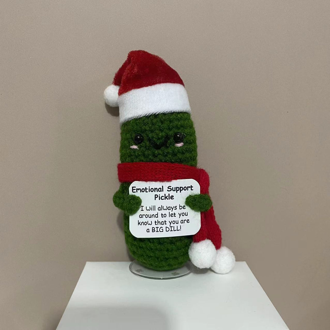 Plüschknuffel mit Weihnachtsmannhut und Schal