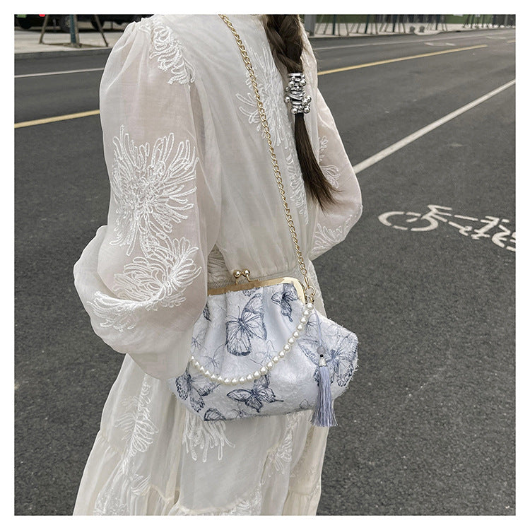 Elegante Clutch mit floralem Motiv