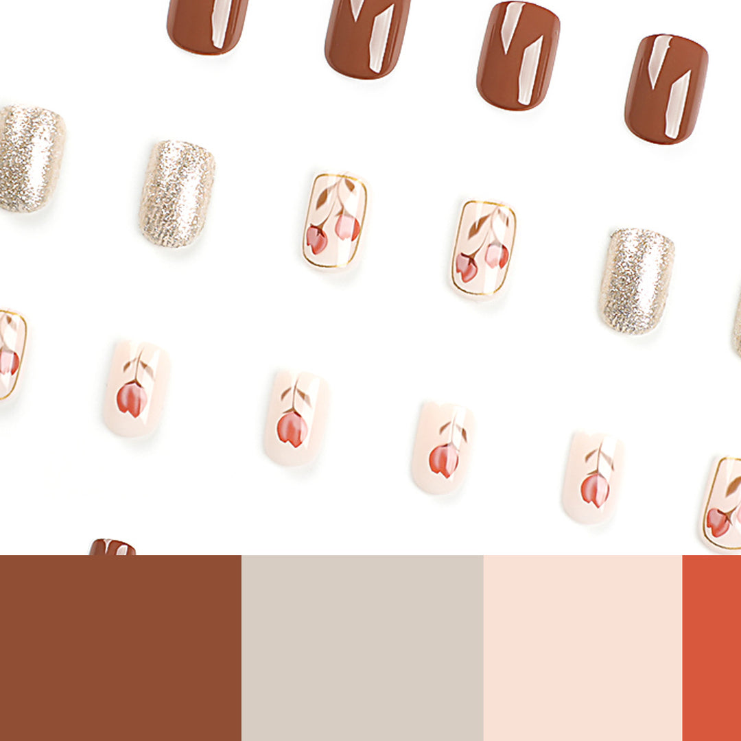 Künstliche Nail Art mit buntem Blumenmotiv und Glitzerakzenten Karnz