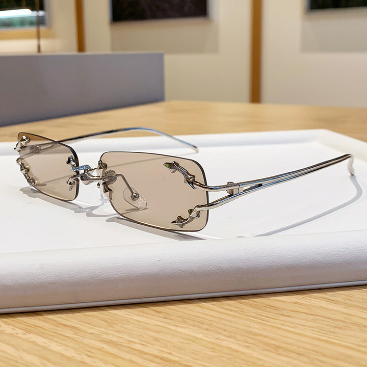 Damen modische Sonnenbrille mit filigranem Metallrahmen und transparenten Gläsern Karnz