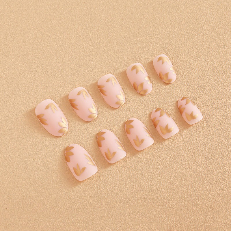 Kunstnagelset mit elegantem Goldblatt-Design Karnz