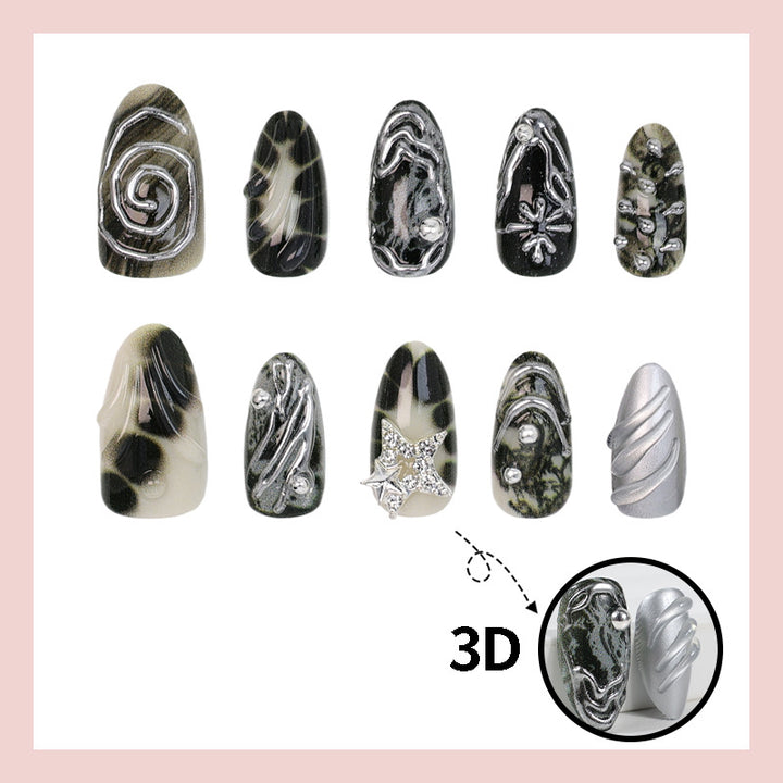 Kunstnagelset mit künstlerischen Mustern und Glitzerakzenten Karnz