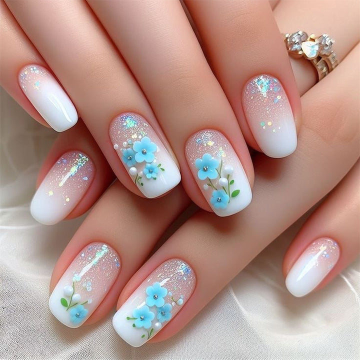Kunstvolle Nagelverlängerungen mit blumigem Design Karnz