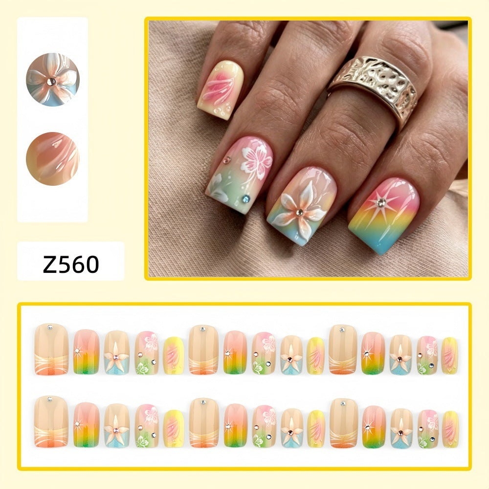 Kunstnägel im lebhaften floralem Design mit Glitzerakzenten Karnz
