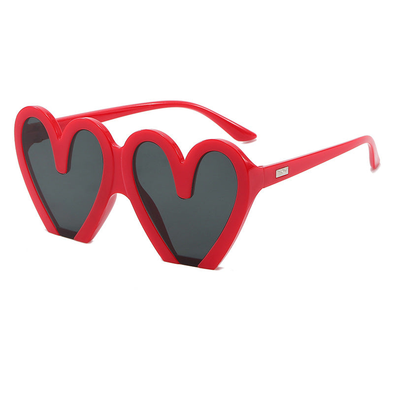Damen Herzförmige Sonnenbrille mit auffälligem Design Karnz