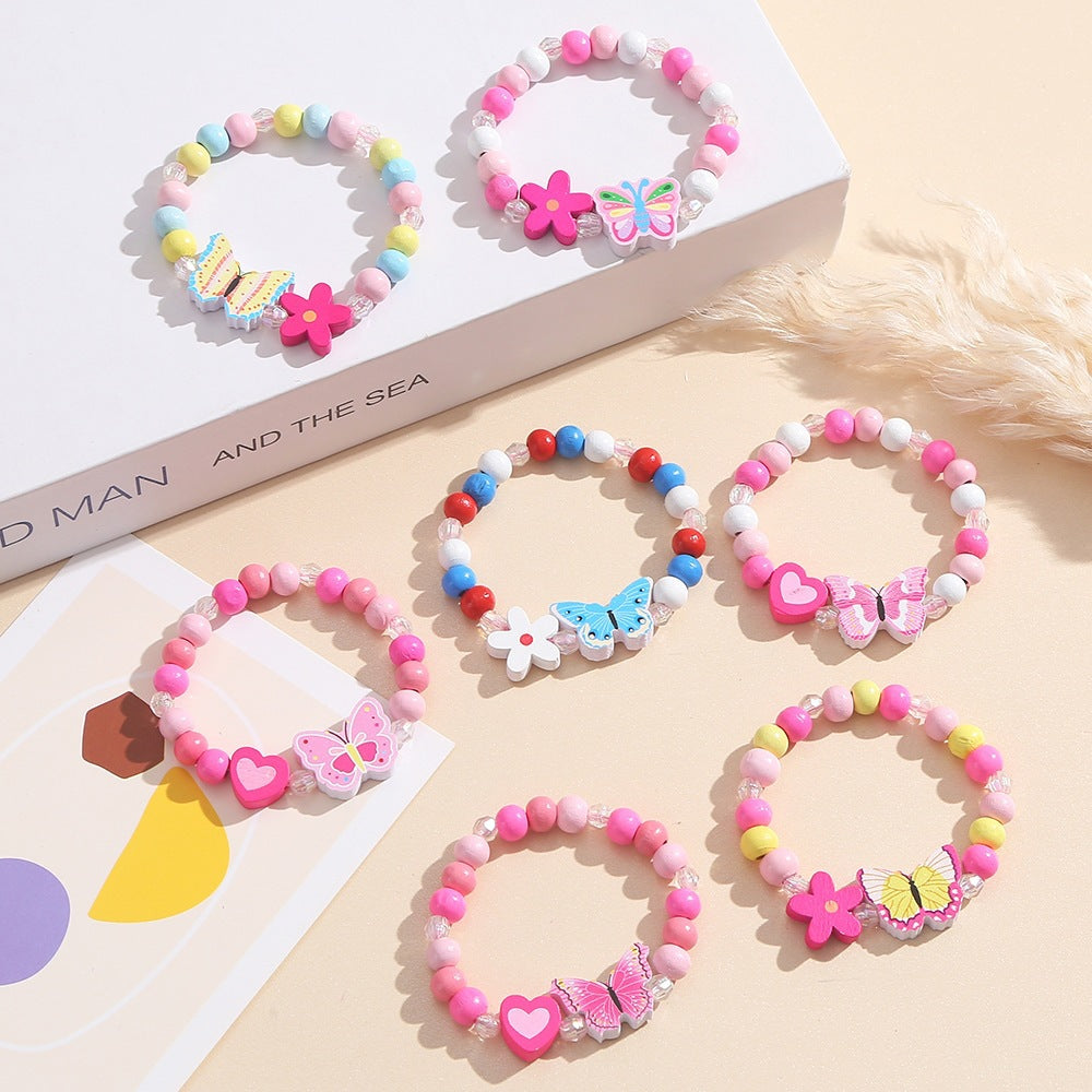 Verspieltes Armband mit Herz- und Schmetterlings-Anhängern Karnz