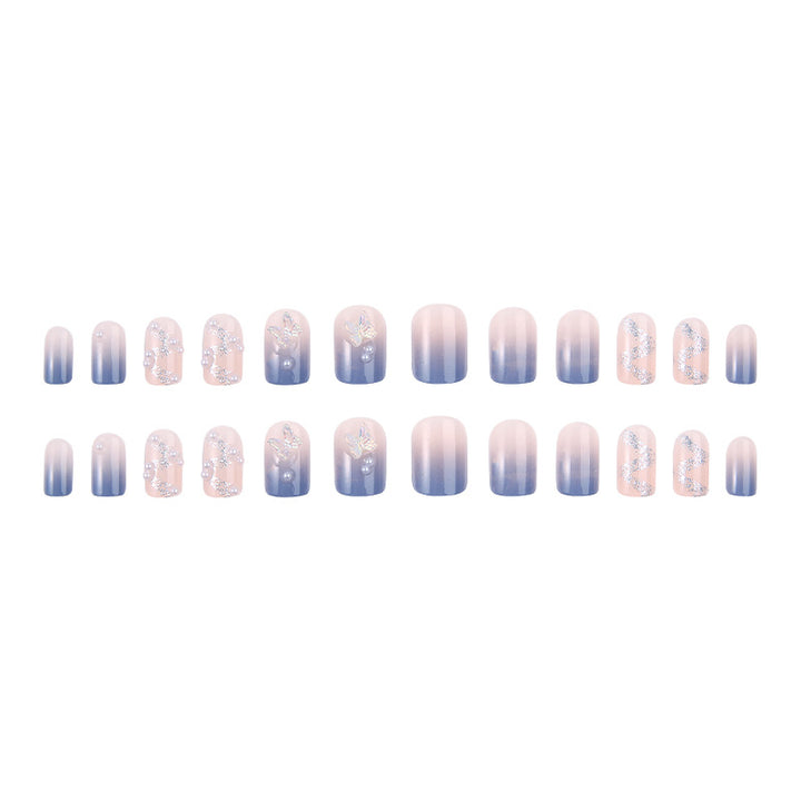 Kunstnagelset mit funkelnden Glitzer-Elementen und ansprechendem Ombre-Design Karnz