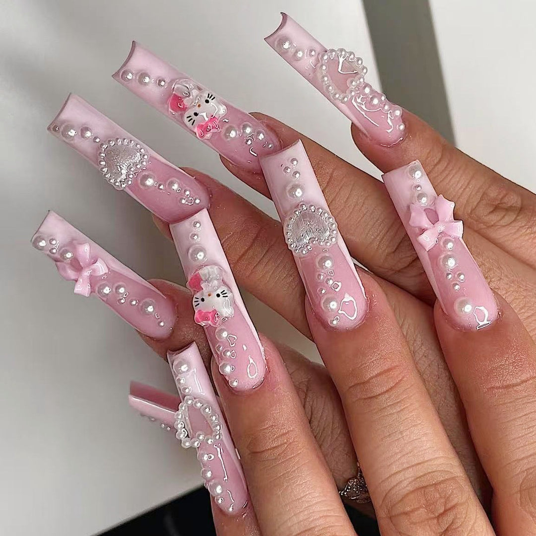 Kunstnagelset mit verspielten 3D-Pflege- und Perlenverzierungen Karnz