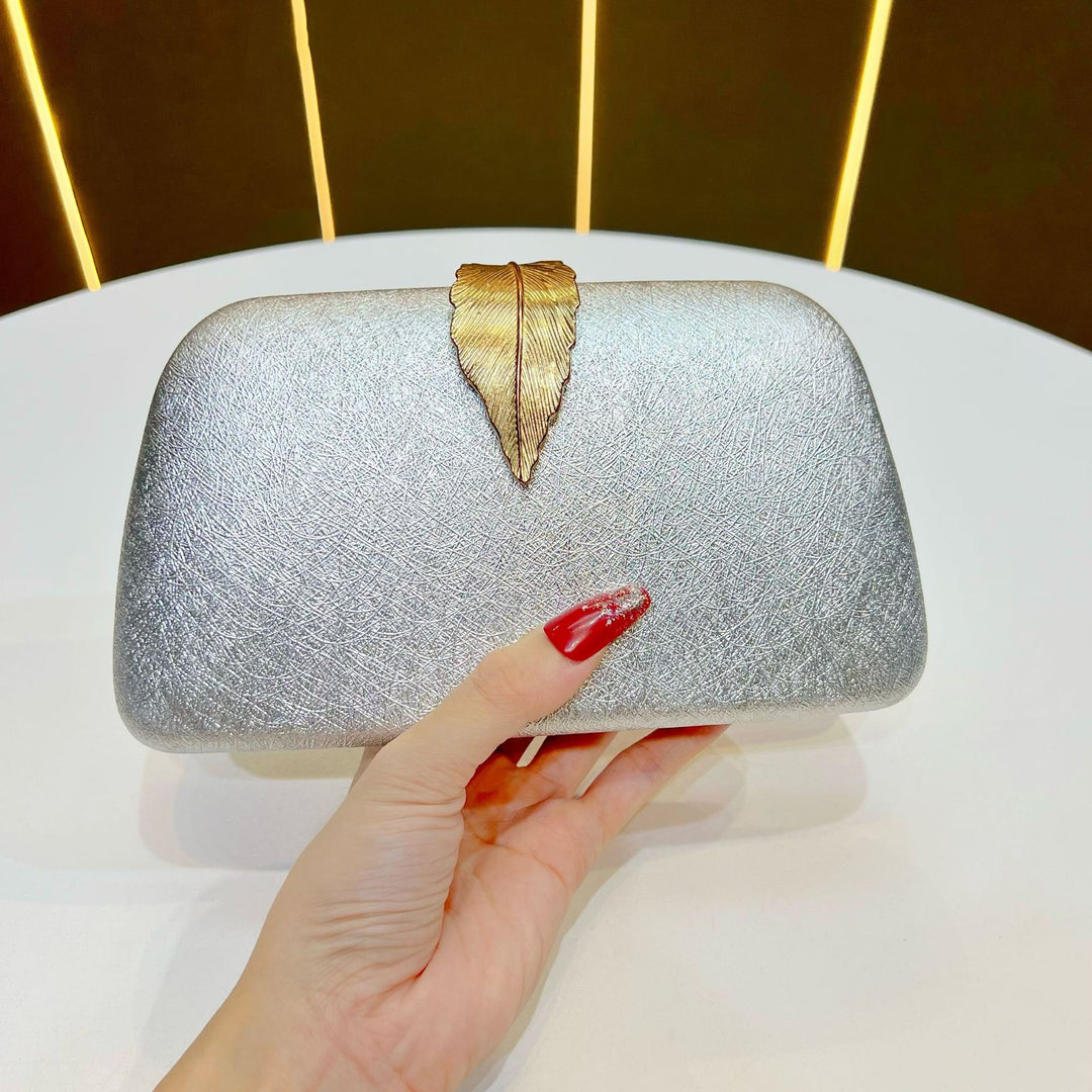 Elegante abendhandtas mit Blattakzenten