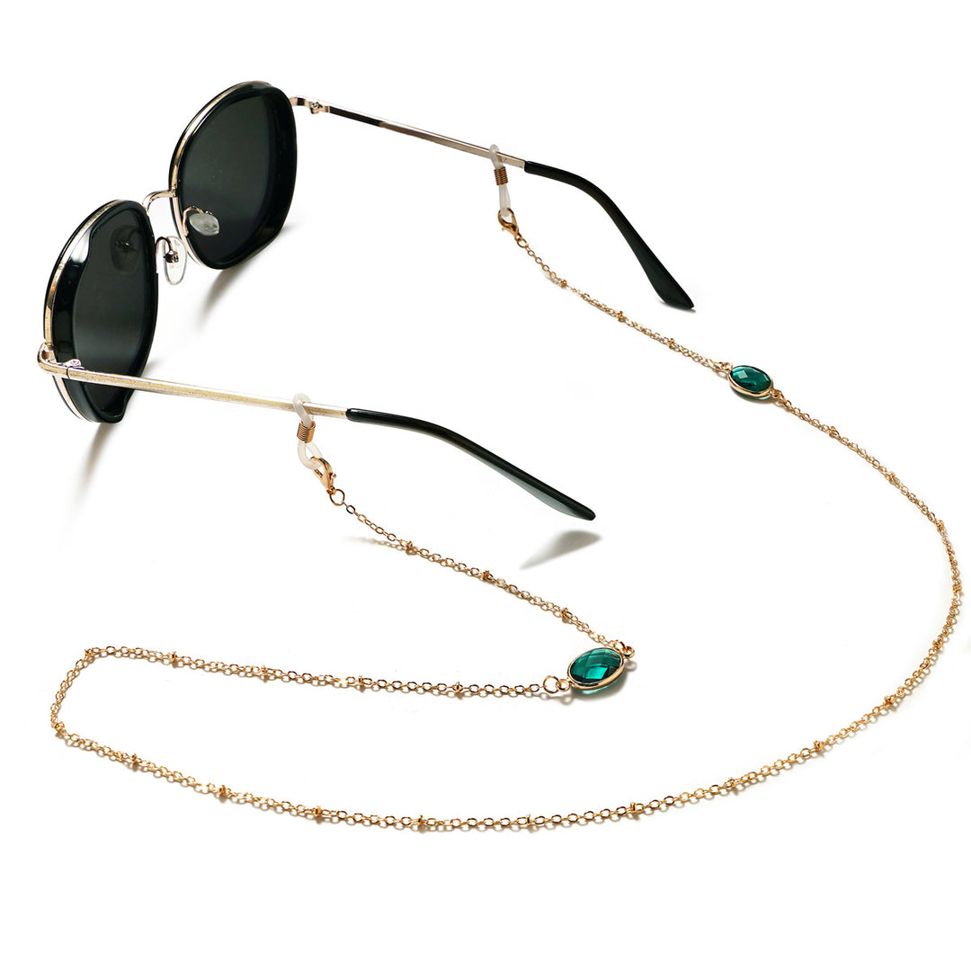 Eleganter mit Edelsteinen verzierter Brillenhalter Karnz