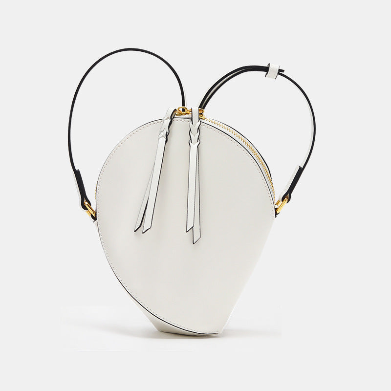Skulpturales Tropfen-Crossbody-Bag mit verstellbarem Riemen & Quastenreißverschluss
