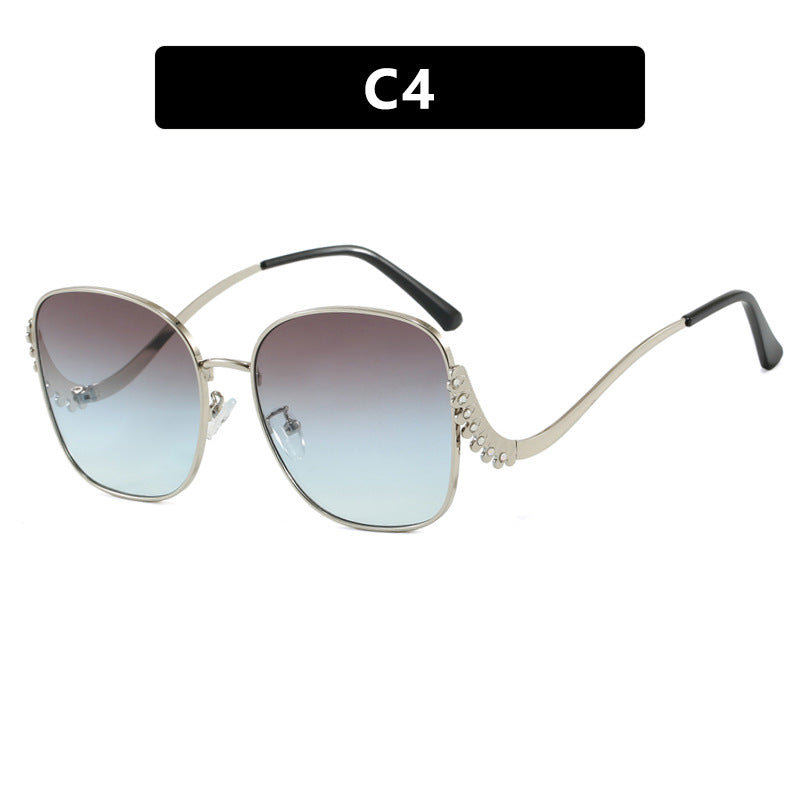 Damen auffällige Sonnenbrille mit funkelnden Applikationen Karnz