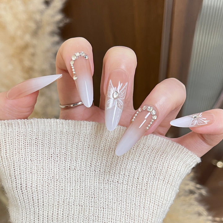 Elegante Stiletto Press-On Nägel mit Perlen- und Blumenmustern Karnz